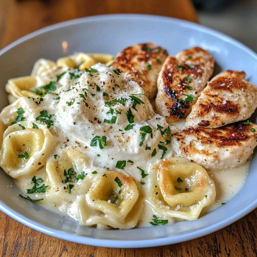 Asiago Tortelloni with Grilled Chicken in Creamy Alfredo Sauce 464223272_122117770310412937_4880046991996882012_n (1)